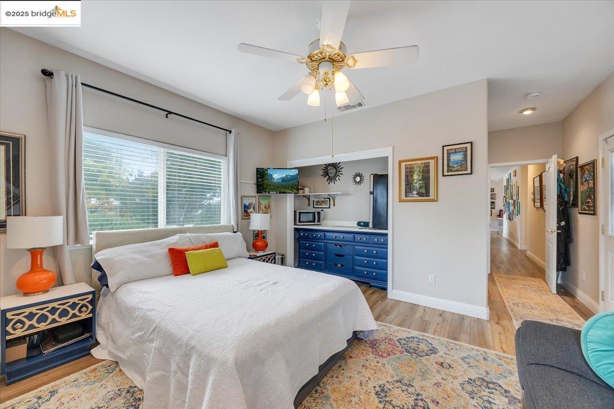 10200 Bell Mooney Road Jamestown, CA 95327 - Photo 38 of 60 a bedroom with a bed and a flat tv screen on dresser