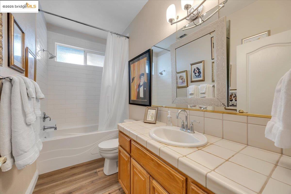 10200 Bell Mooney Road Jamestown, CA 95327 - Photo 39 of 60 a bathroom with a granite countertop sink toilet and shower