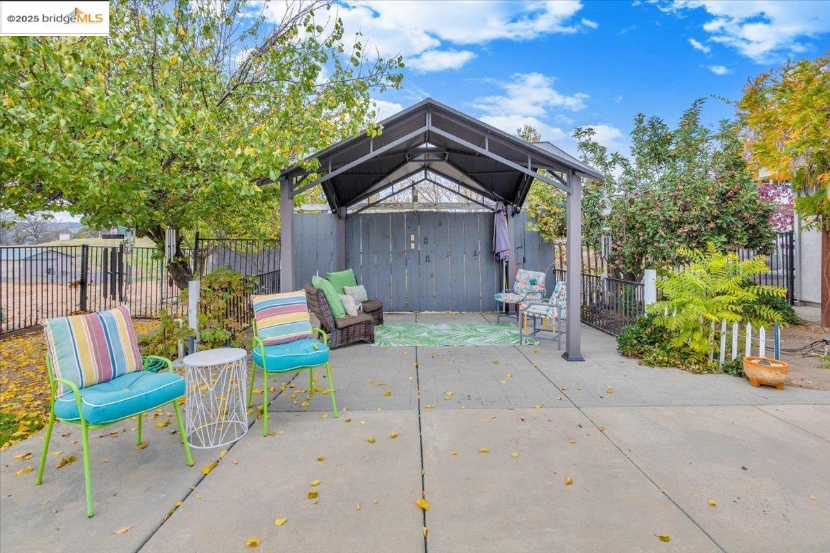 10200 Bell Mooney Road Jamestown, CA 95327 - Photo 44 of 60 a view of backyard with outdoor seating and green space