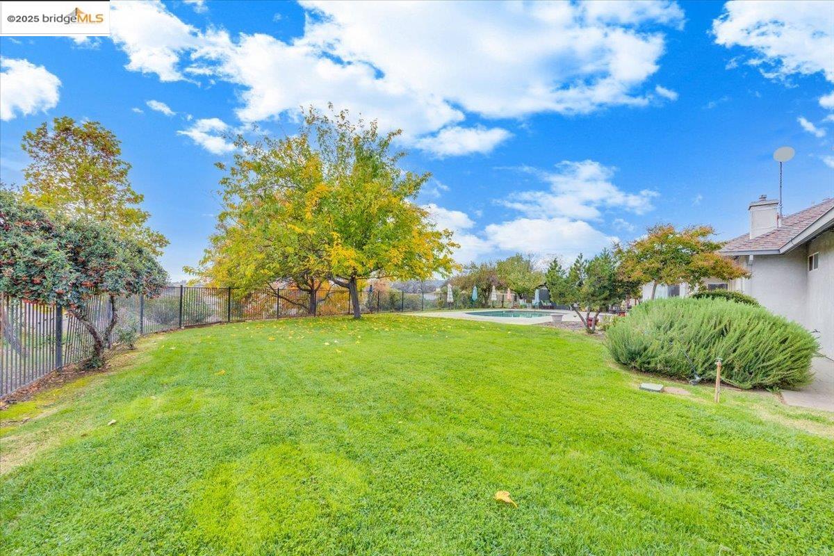 10200 Bell Mooney Road Jamestown, CA 95327 - Photo 48 of 60 Fenced backyard with a patio area