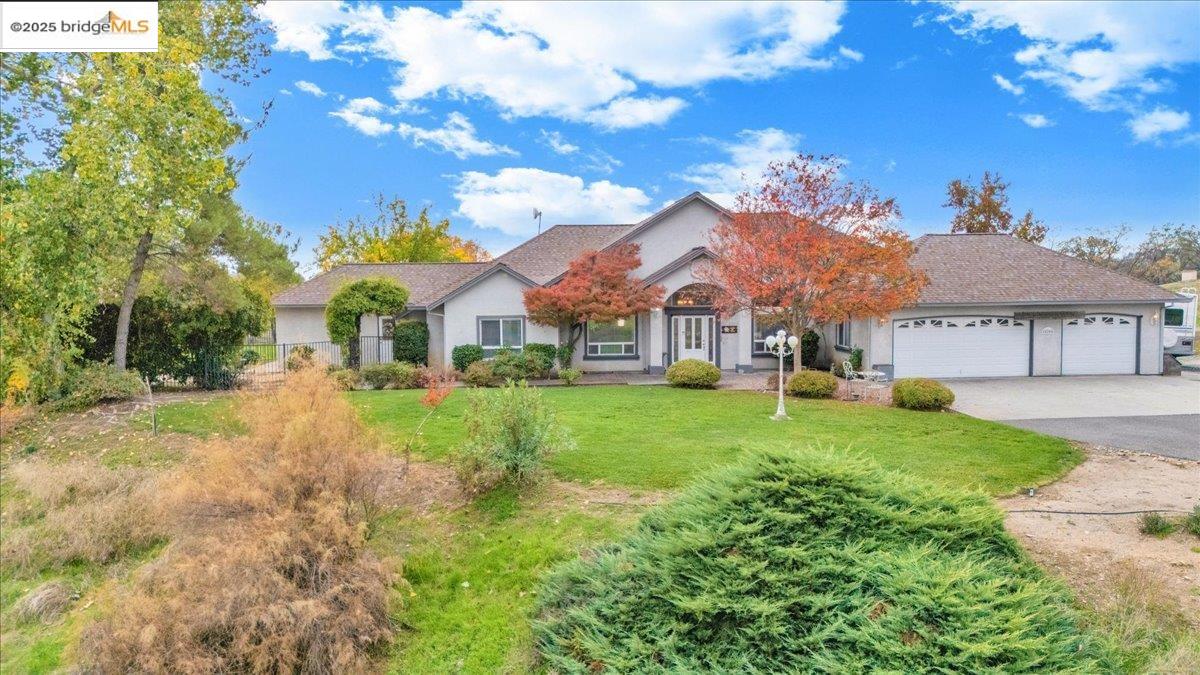 10200 Bell Mooney Road Jamestown, CA 95327 - Photo 49 of 60 a view of a house with a big yard plants and large tree