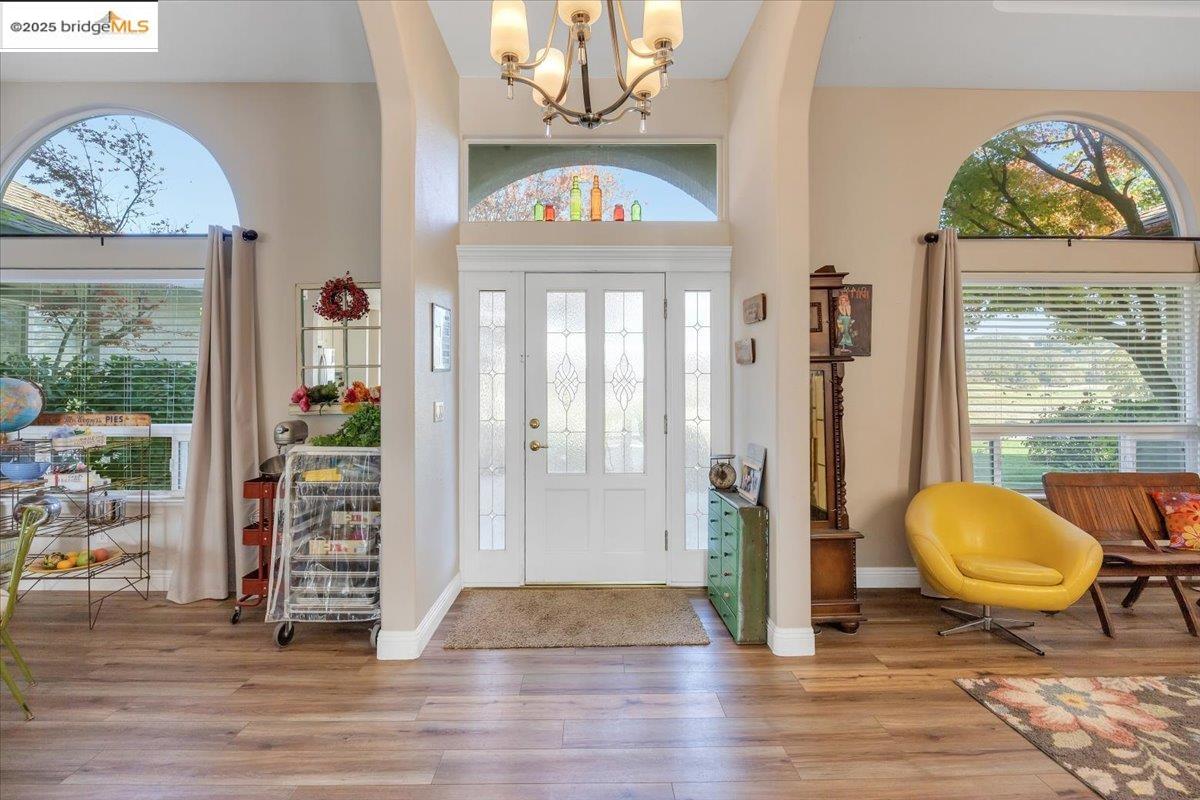10200 Bell Mooney Road Jamestown, CA 95327 - Photo 5 of 60 a view of an entryway with wooden floor and a livingroom