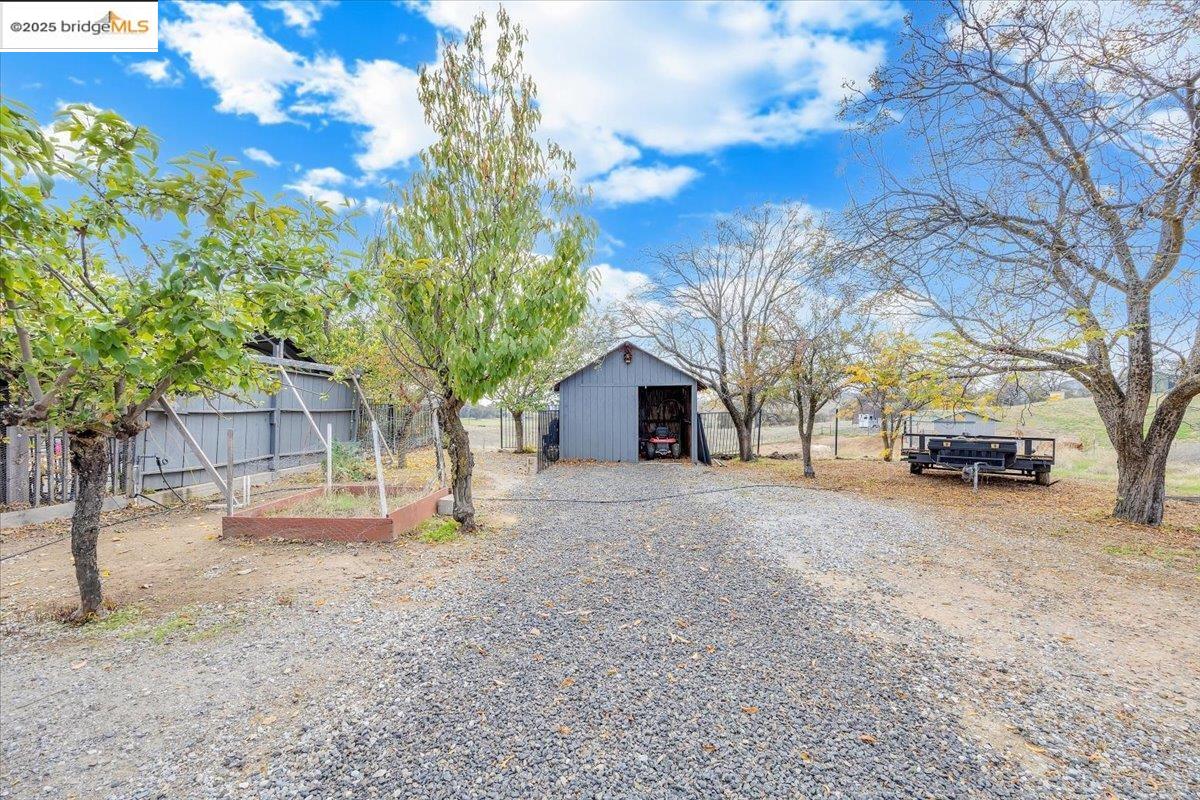 10200 Bell Mooney Road Jamestown, CA 95327 - Photo 53 of 60 a house with trees in front of it