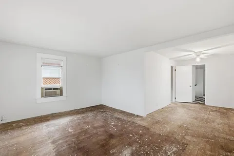 a view of a room that has a window in it