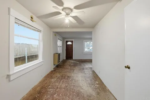 en empty room with windows and closet