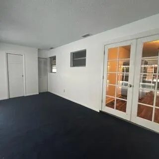 a view of an empty room with a window