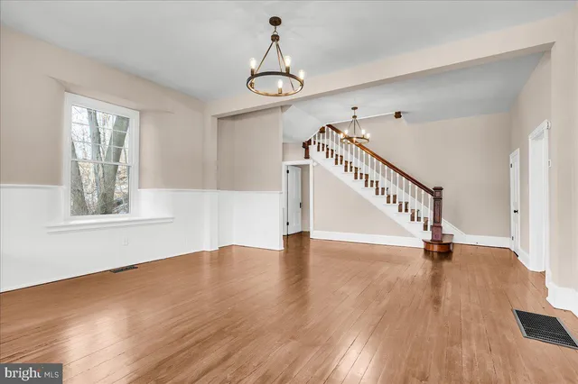 a view of an entryway with wooden floor