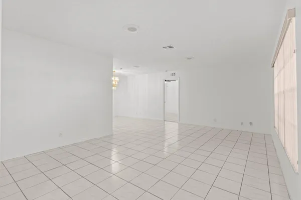 an empty room with white walls