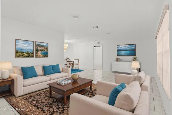 a living room with furniture and a rug