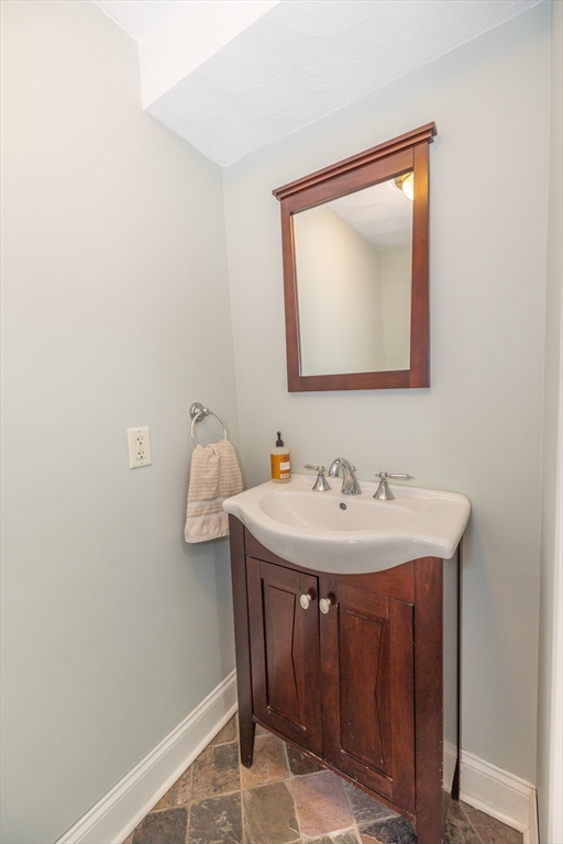 12 Post Road North Billerica, MA 01862 - Photo 15 of 38 a bathroom with a sink and a mirror