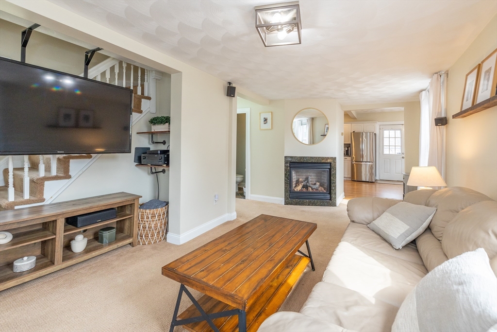 12 Post Road North Billerica, MA 01862 - Photo 17 of 38 a living room with furniture and a flat screen tv