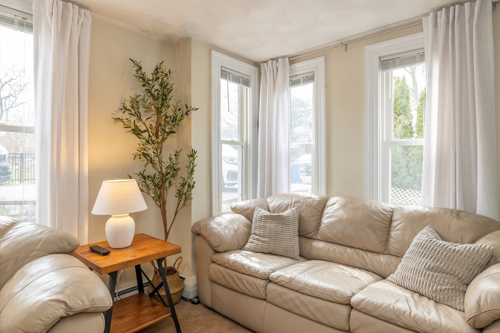12 Post Road North Billerica, MA 01862 - Photo 18 of 38 a living room with furniture and a large window