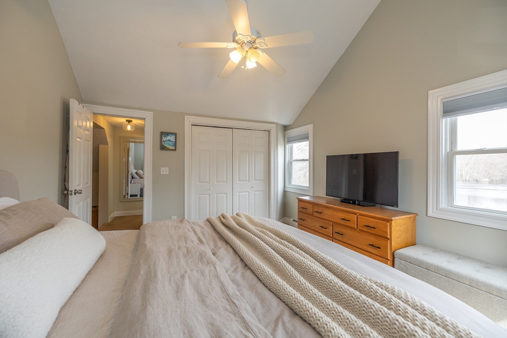 12 Post Road North Billerica, MA 01862 - Photo 24 of 38 a bedroom with a bed and a flat screen tv