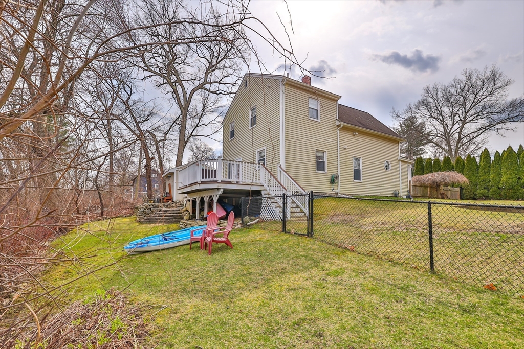 12 Post Road North Billerica, MA 01862 - Photo 33 of 38 a view of a house with a yard patio and fire pit