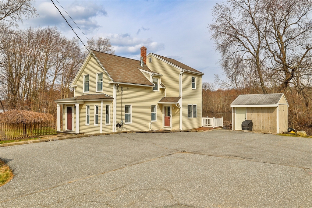 12 Post Road North Billerica, MA 01862 - Photo 36 of 38 front view of a house with a street