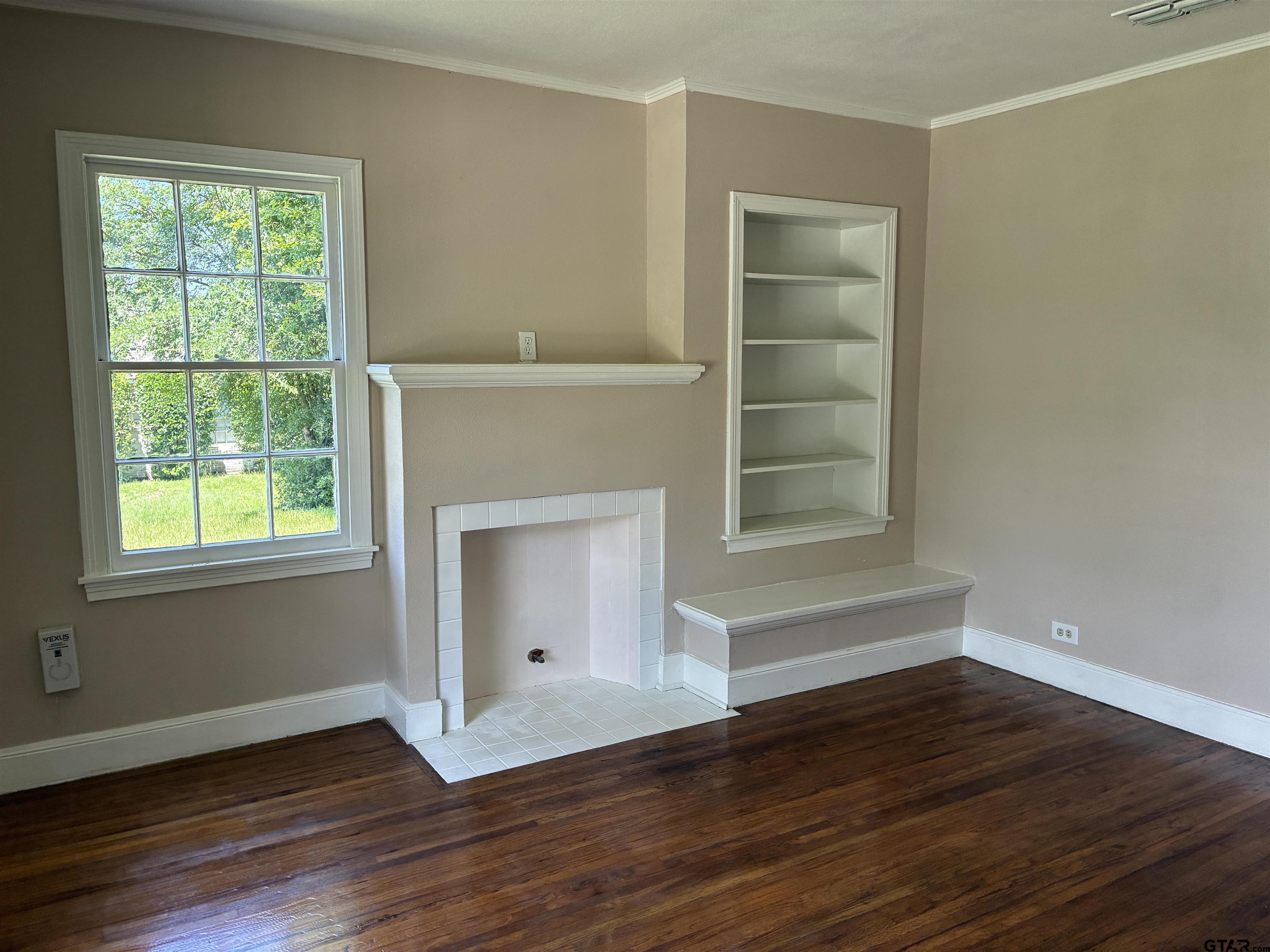 811 West 5th Street Tyler, TX 75701 - Photo 4 of 26 a view of empty room with wooden floor and fan