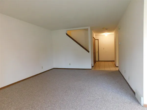 a view of a room with a hallway