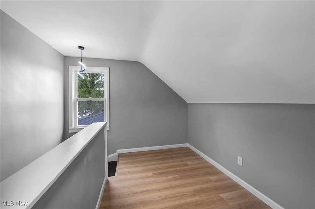 20202 Sumpter Road Cleveland, OH 44128 - Photo 42 of 46 Bonus room featuring light wood-style floors and vaulted ceiling