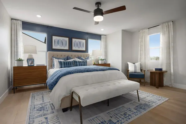 a bedroom with a large bed rug and a window