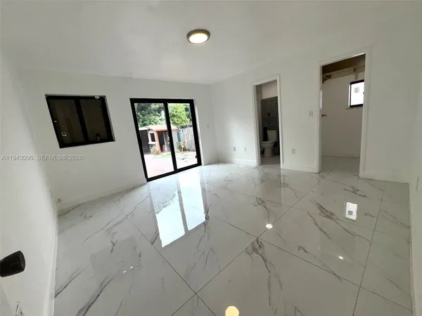 a bathroom with a toilet sink and shower