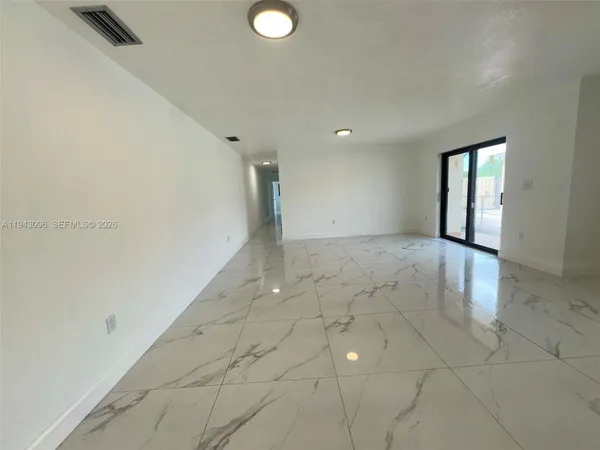 a kitchen with stainless steel appliances granite countertop a sink stove and microwave