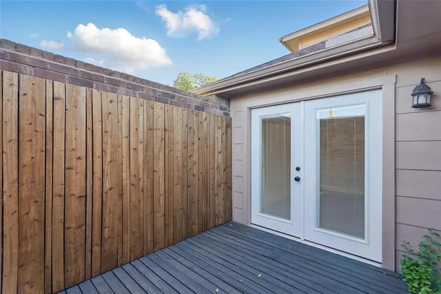 a view of a wooden door and wooden floor