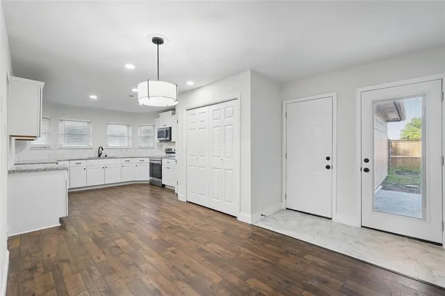 a view of a kitchen with a sink cabinets and window