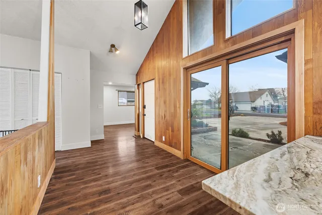 a view of a hallway view with wooden floor and staircase