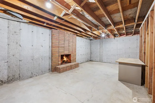 a view of an empty room with a fireplace