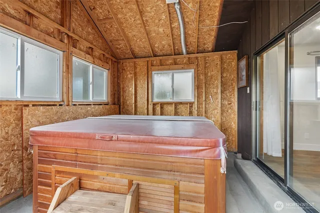 a bathroom with a tub and shower
