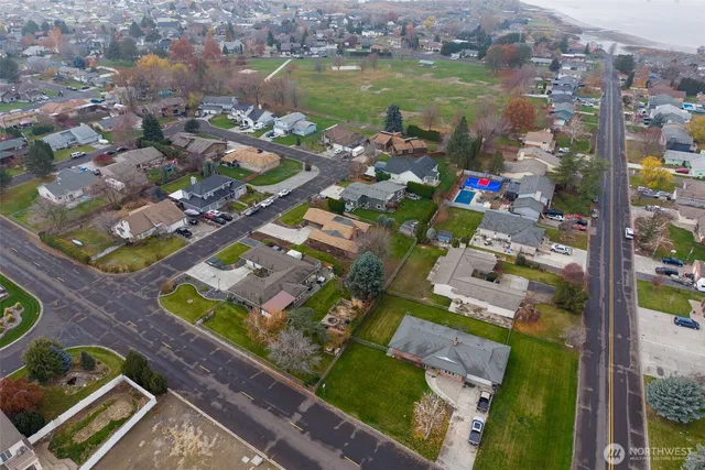 an aerial view of residential houses with outdoor space