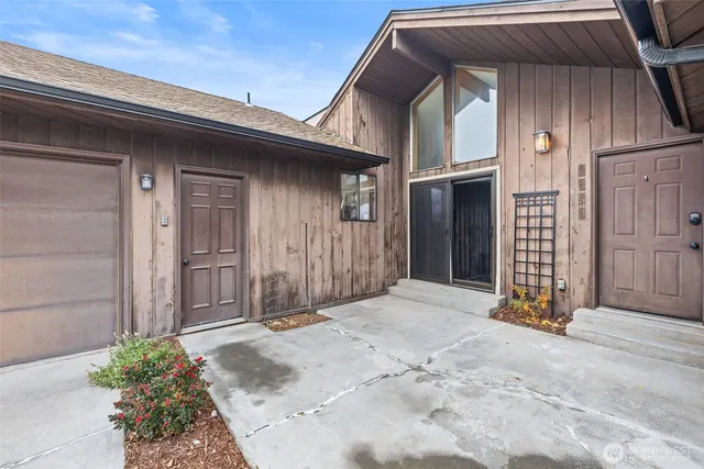 a view of entryway with wooden walls