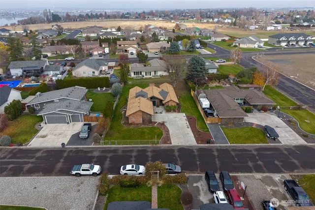 an aerial view of residential houses and outdoor space