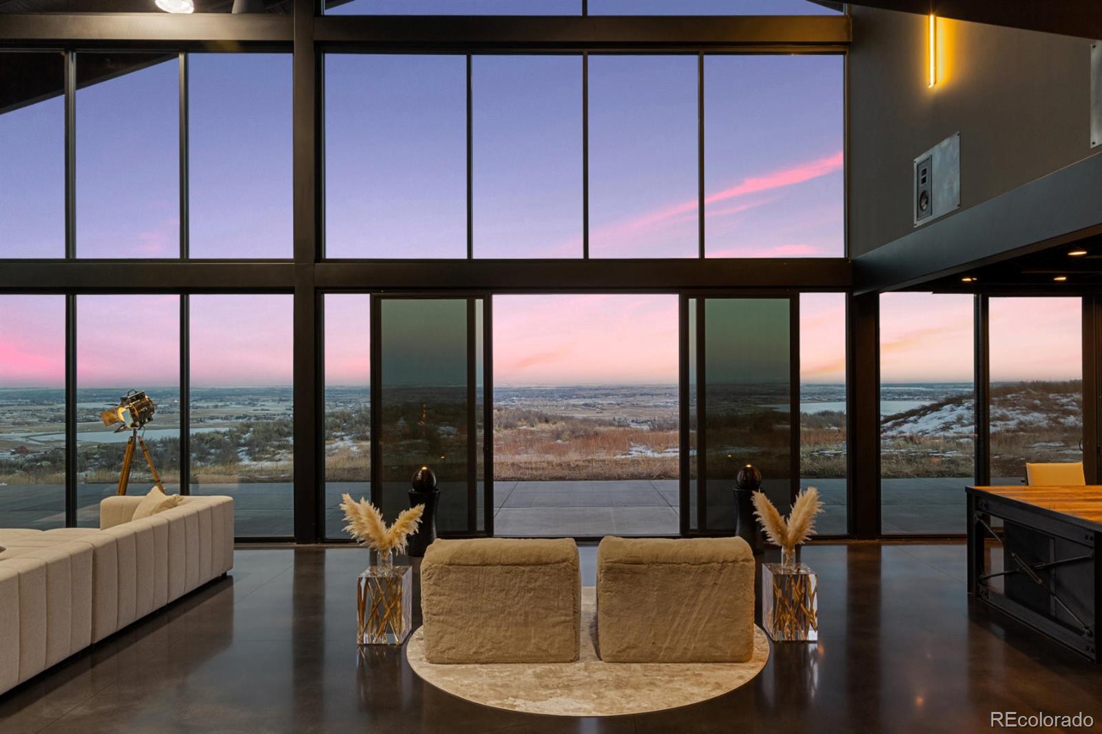 6502 Kiva Ridge Drive Berthoud, CO 80513 - Photo 13 of 50 a living room with furniture and a floor to ceiling window