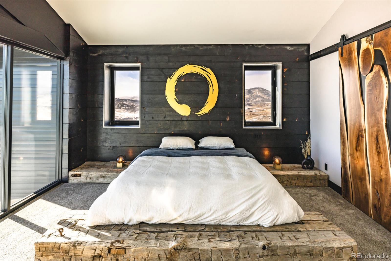 6502 Kiva Ridge Drive Berthoud, CO 80513 - Photo 34 of 50 a bedroom with a bed and a mirror