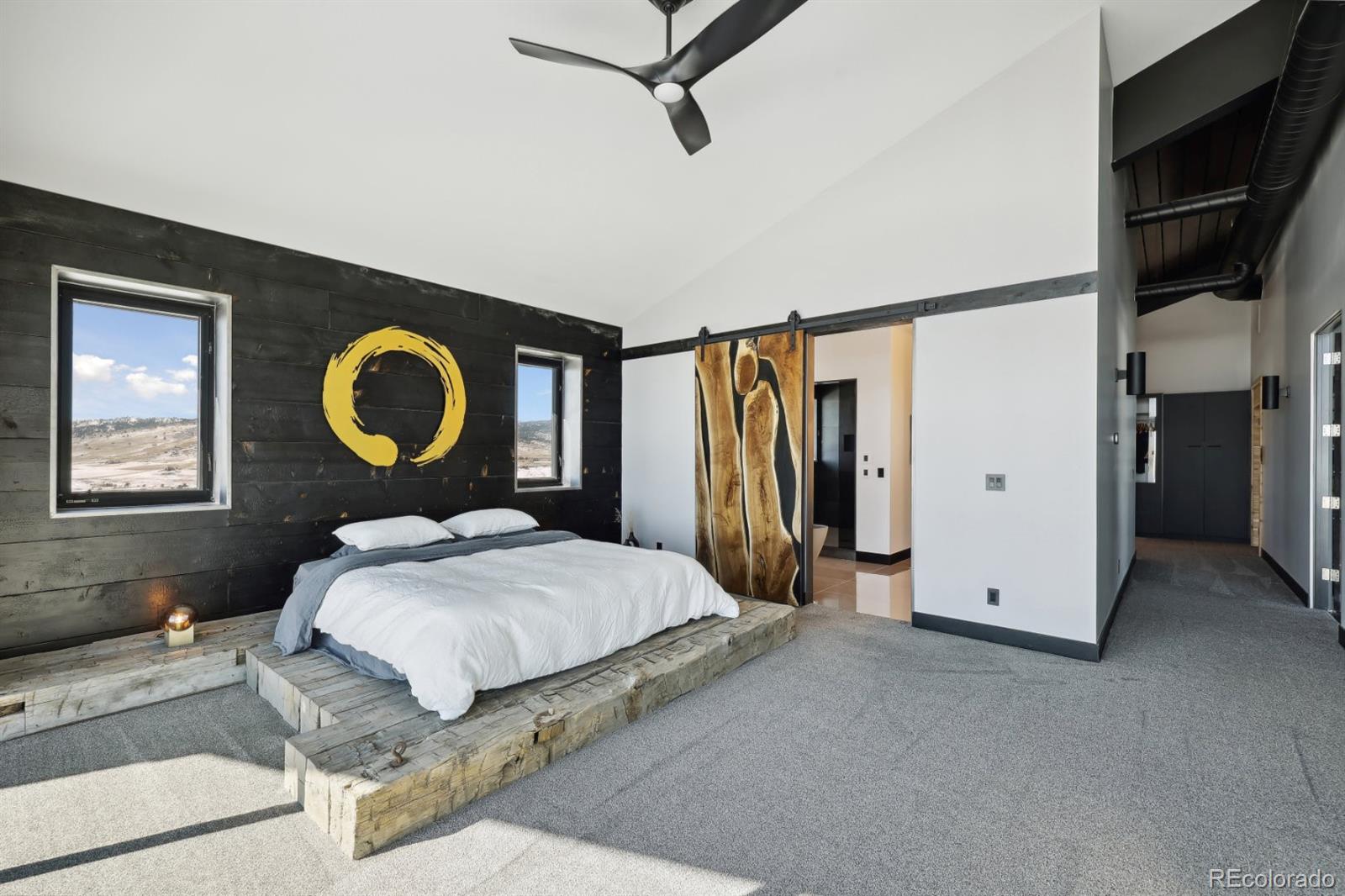 6502 Kiva Ridge Drive Berthoud, CO 80513 - Photo 36 of 50 a bedroom with a bed and a painting on the wall