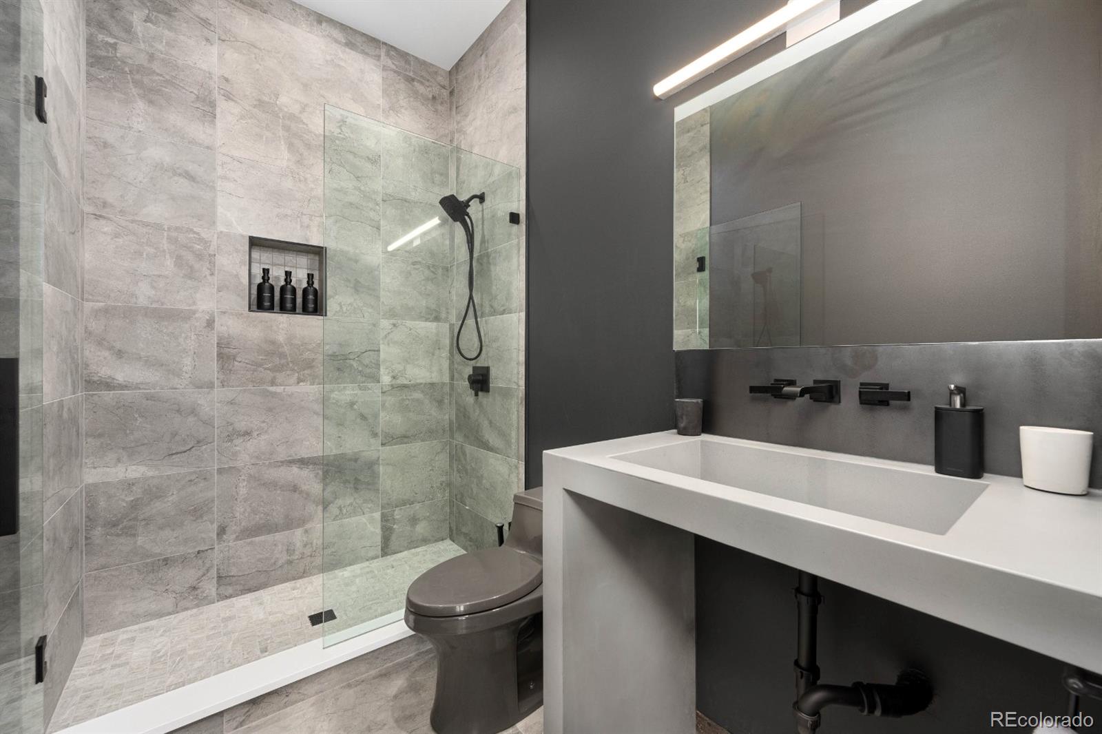 6502 Kiva Ridge Drive Berthoud, CO 80513 - Photo 46 of 50 a bathroom with a sink a toilet and shower