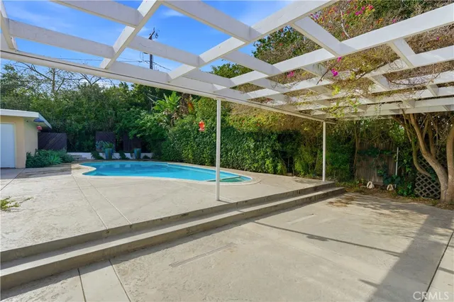 a view of a backyard with a small cabin