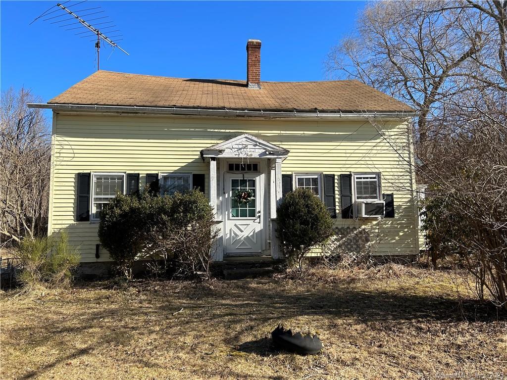 82 Roper Road Plainfield, CT 06354 - Photo 1 of 1 a front view of a house with garden