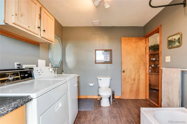 a view of bathroom with a sink toilet and tub