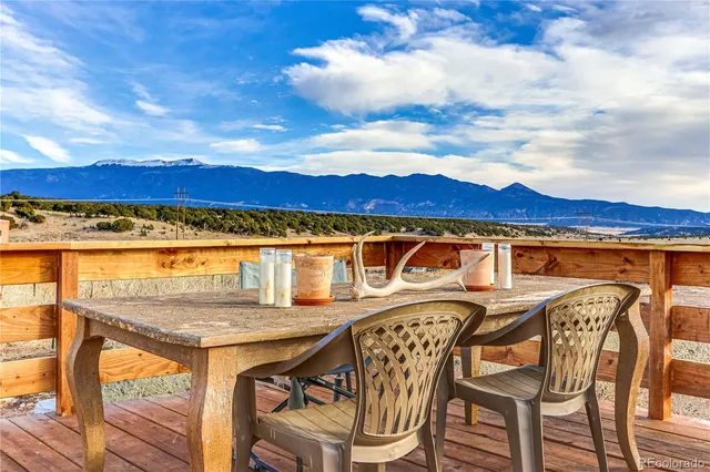 a view of a chairs and table on the terrace