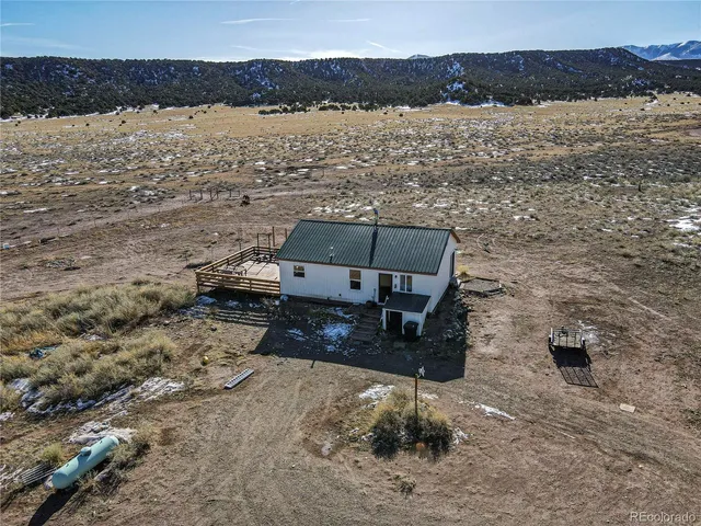 a view of an ocean beach and mountain