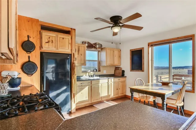 a kitchen with stainless steel appliances granite countertop a stove and a refrigerator