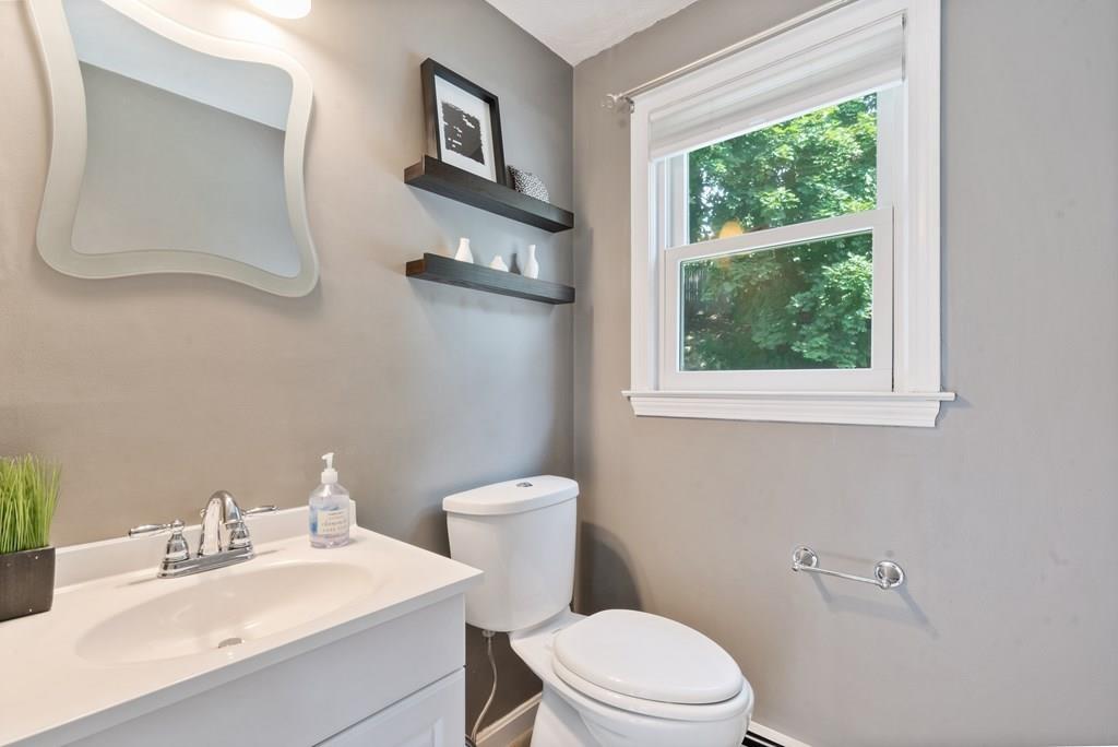 36 Intervale Road Waltham, MA 02453 - Photo 11 of 38 a white toilet sitting next to a bathroom sink