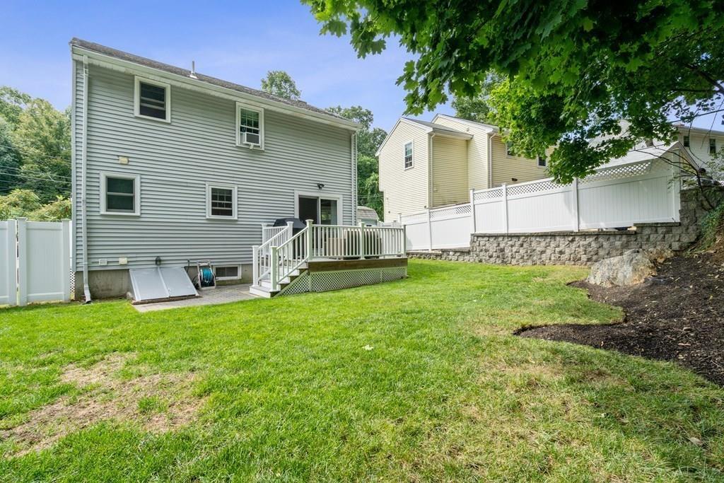 36 Intervale Road Waltham, MA 02453 - Photo 23 of 38 a front view of a house with a yard and garage