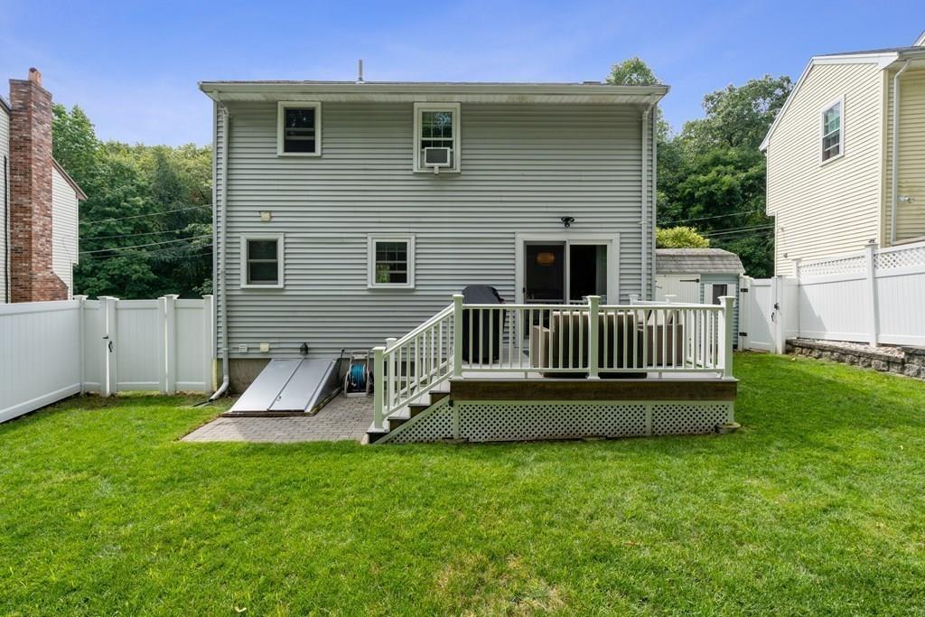 36 Intervale Road Waltham, MA 02453 - Photo 25 of 38 a view of a chair and table in backyard