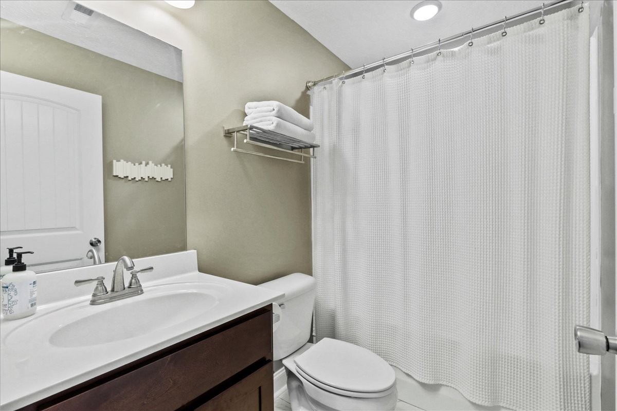 752 Cedar Street Springfield, TN 37172 - Photo 21 of 41 a bathroom with a sink a toilet and shower curtain