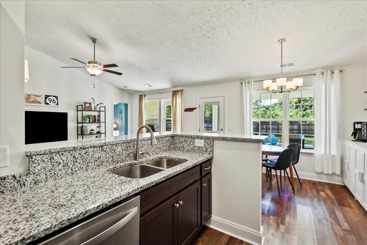 752 Cedar Street Springfield, TN 37172 - Photo 9 of 41 a kitchen with a center island wooden floor and a large window