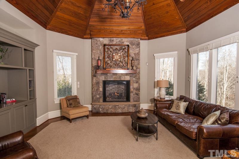 11200 Jonas Ridge Lane Raleigh, NC 27613 - Photo 11 of 25 a living room with furniture and a fireplace