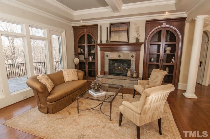 11200 Jonas Ridge Lane Raleigh, NC 27613 - Photo 14 of 25 a living room with furniture and a fireplace